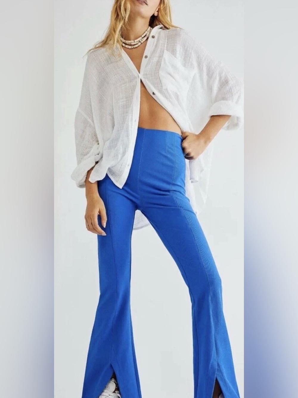 Free People Real Deal Slit Flare pants w/vibrant blue color distinct hem slits.